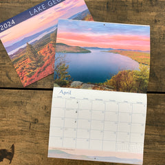 2024 wall calendar cover and inside spread showing April's photo, which is the view of Lake George from Rogers Rock.