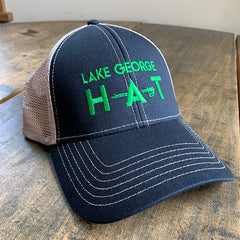 Green embroidery "Lake George H-A-T" on navy blue chino, trucker style mesh back.