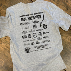 Text: "Lake George Land Conservancy 2024 Hike-A-Thon" 
Below the text are sponsor logos all printed in black ink.