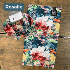 Colorful floral-patterned fabric on a white background with black and white embroidered labels featuring the LGLC logo and Skida logo. “Rosalie”