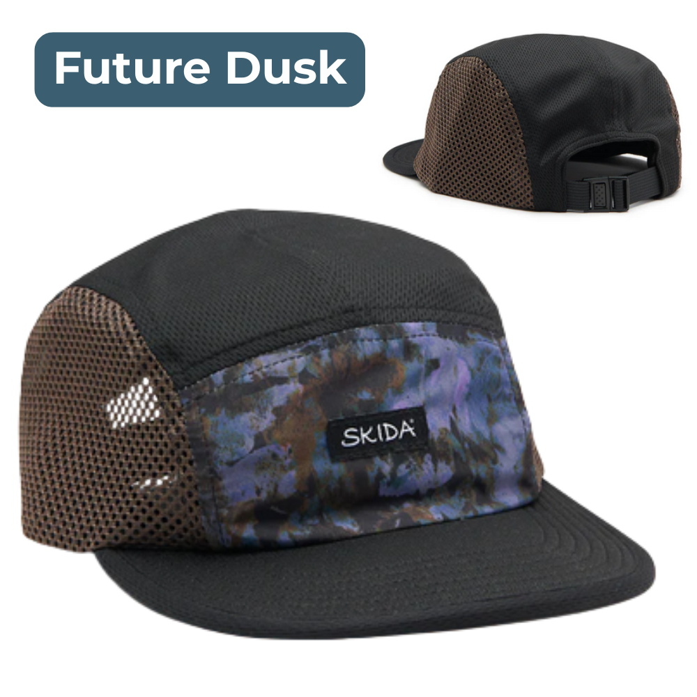 Black cap with camouflage pattern and mesh side, featuring the Skida brand, labeled 'Future Dusk'.