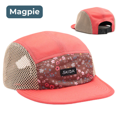 Pink cap with floral pattern and mesh back, featuring Skida branding, on a white background.