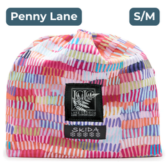White beanie with a bright hash-mark like geometric pattern of pinks, orange, blue and green, with black and white embroidered labels featuring the LGLC logo and Skida logo. "Penny Lane"