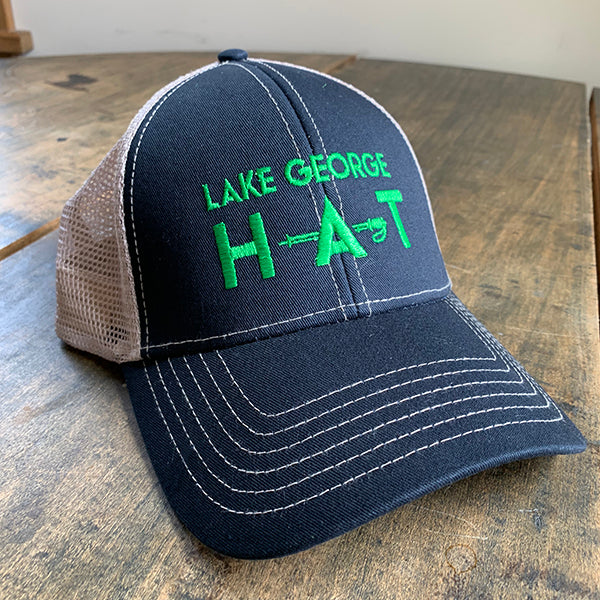 Green embroidery "Lake George H-A-T" on navy blue chino, trucker style mesh back.
